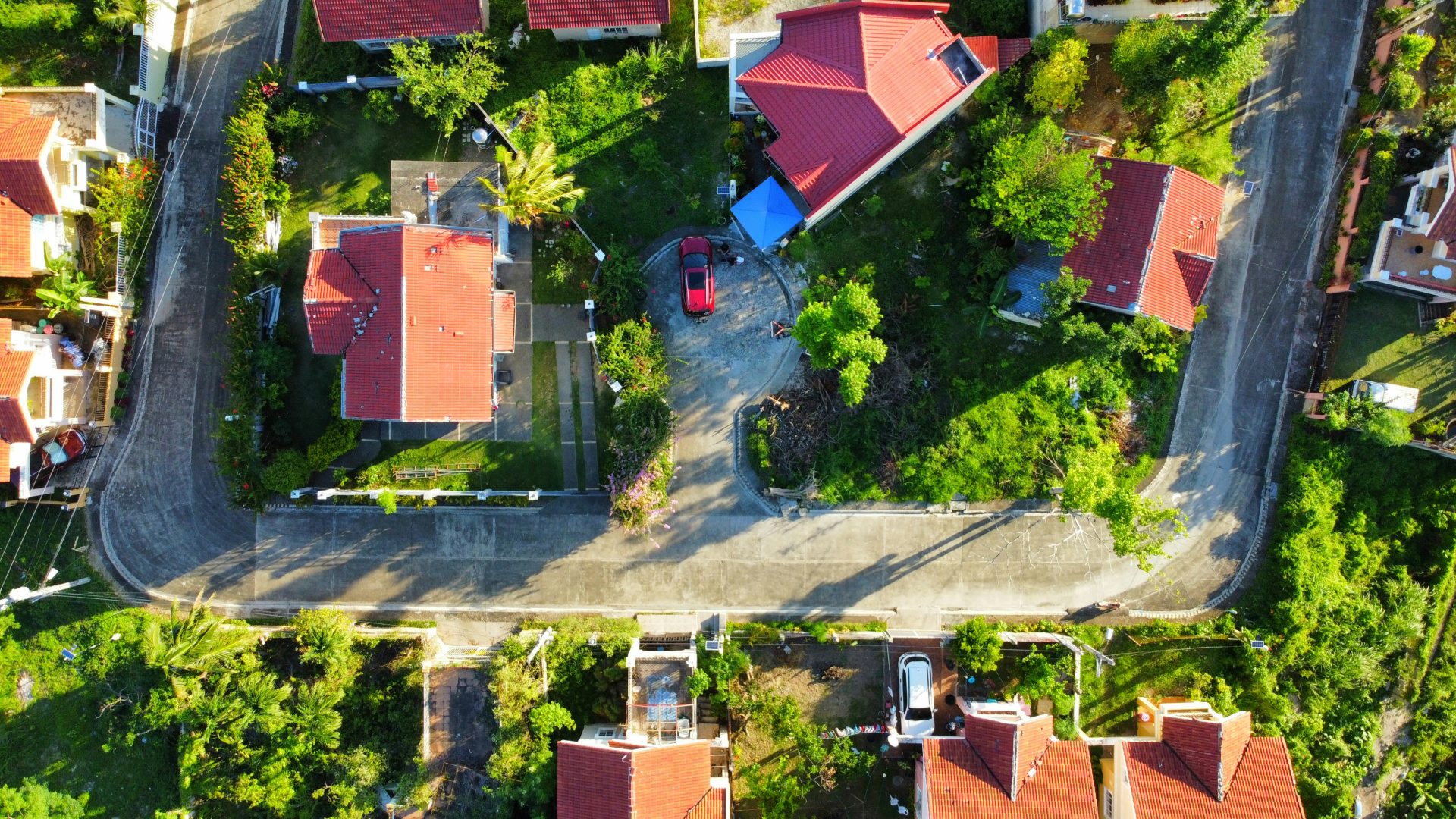 an aerial view of a neighborhood with houses and trees
